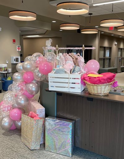 A Picture of Baby Shower Balloons and Gifts