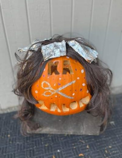 A Picture of Painted Pumpkin with Wig